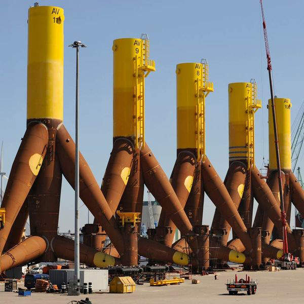 The tripod support structures for the wind turbines being assembled. Image courtesy of Trianel.