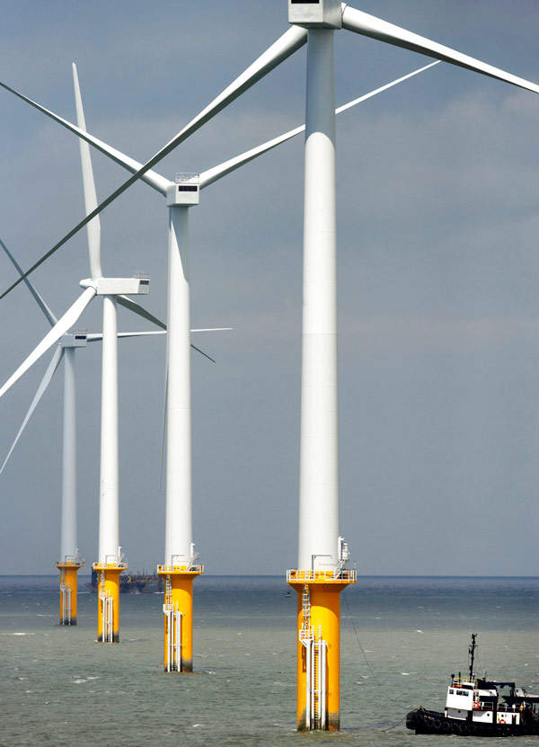The turbine towers are supported by 52m long steel monopiles.